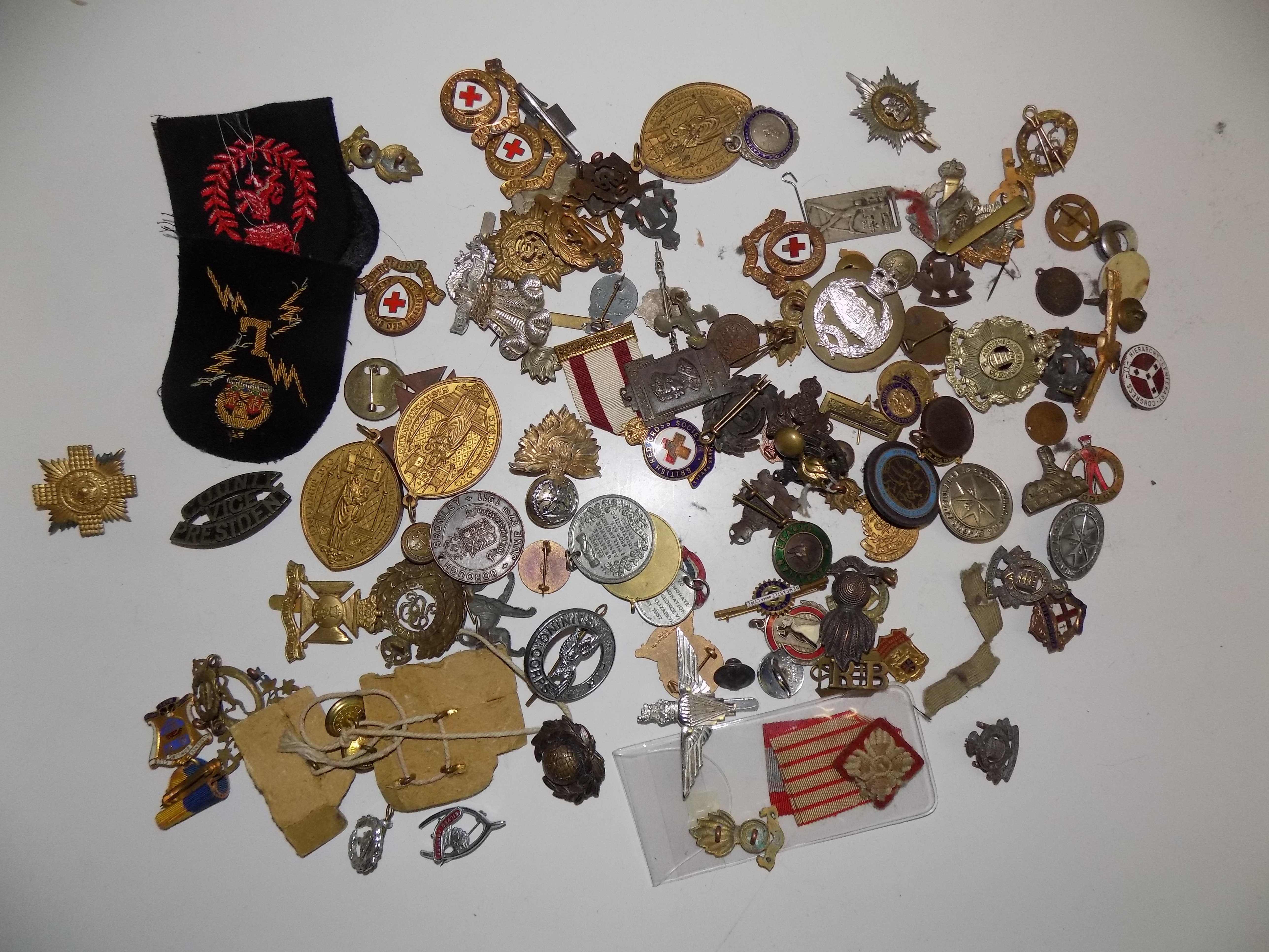 A collection of badges, medallions etc.