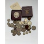 A quantity of British and foreign silver coins etc.