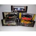 Three Burago large scale cars and two others, each boxed.