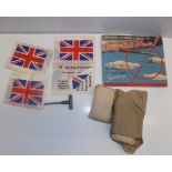 Three British Russian identification fabric flags, a bomb jettison pull and bandages.