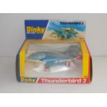 Dinky :- 106 Thunder Bird II blue with white base and red legs, window box.