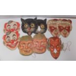 Nine cased full size party masks.