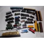 A collection of locomotives by Airfix and others, together with wagons and carriages.