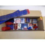 Meccano:- A collection of various plates, cylinders etc in blue, red and yellow.