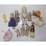 A collection of miniature dolls including an Edwardian sailor doll and several other all porcelain