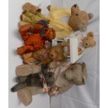 Seven teddy bears, most are love worn, together with a dolls high chair.