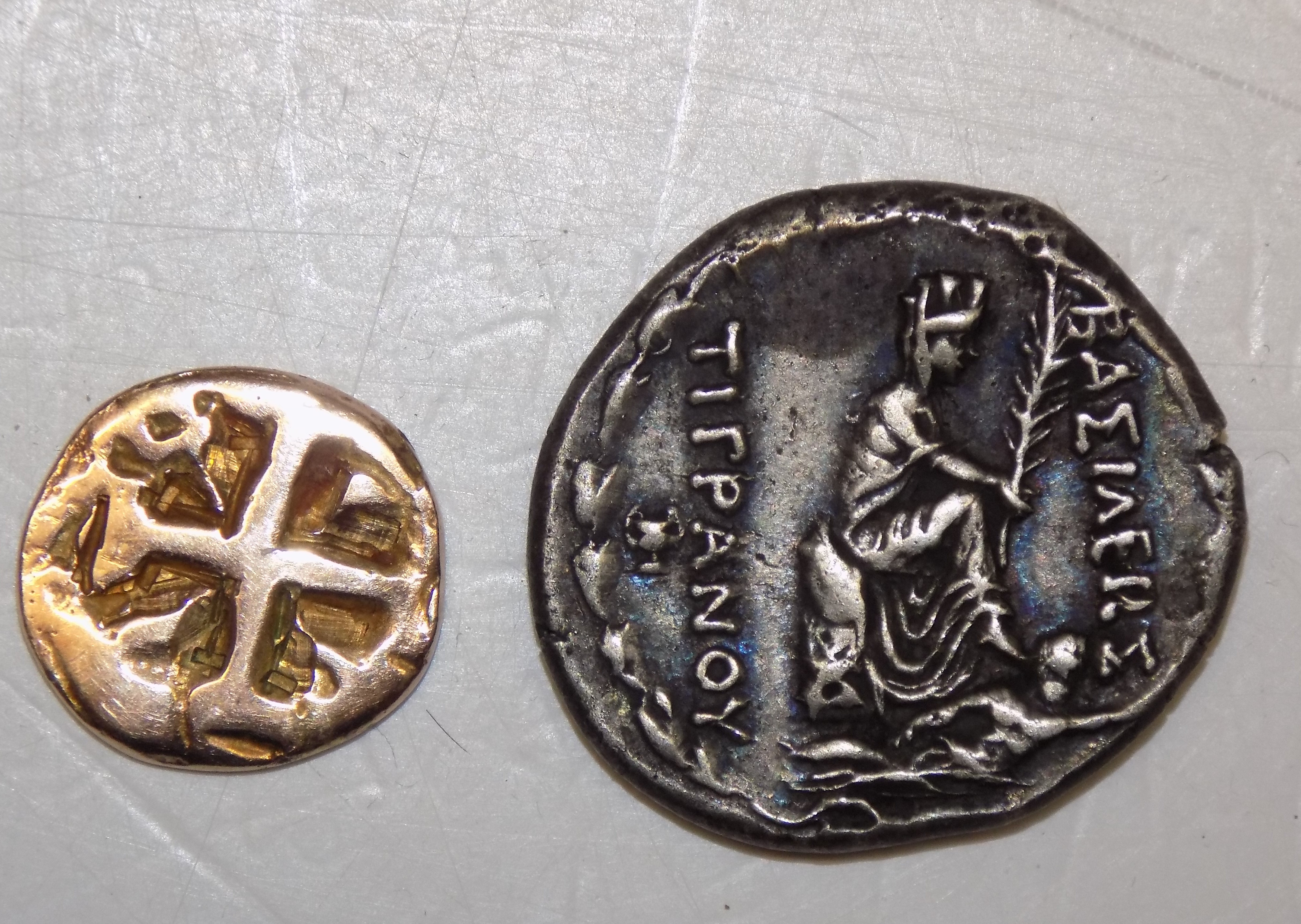 A 9 ct gold copy of an ancient coin and a copy Roman coin.