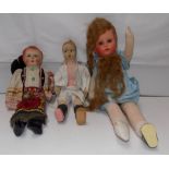 Three fabric dolls each with moulded head.