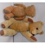 Two plush covered teddy bears, one with remains of growler.