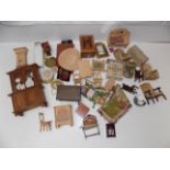 A quantity of mainly wood dolls house furniture, includes a tin plate mangle and a Bakelite radio.