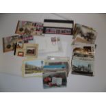 Approximately one hundred postcards together with mint stamps, coin covers etc.