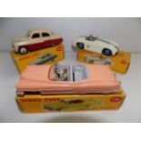 Dinky :- 164 Vauxhall Cresta, 133 Cunningham and 131 Cadillac, each boxed.