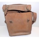 A leather carrying bag, to the front is embossed "F.