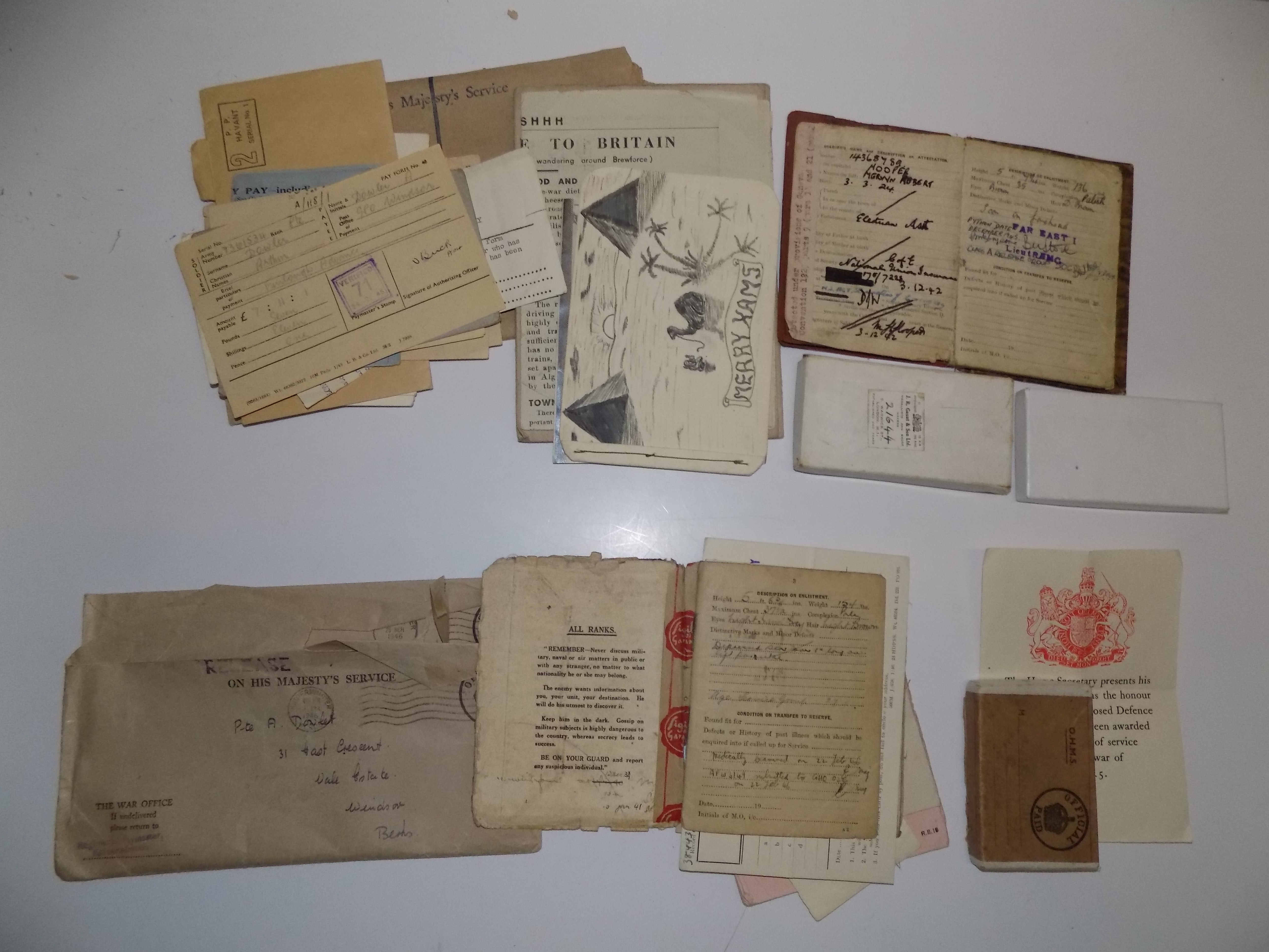 Two lots of WWII paperwork including service and paybooks.