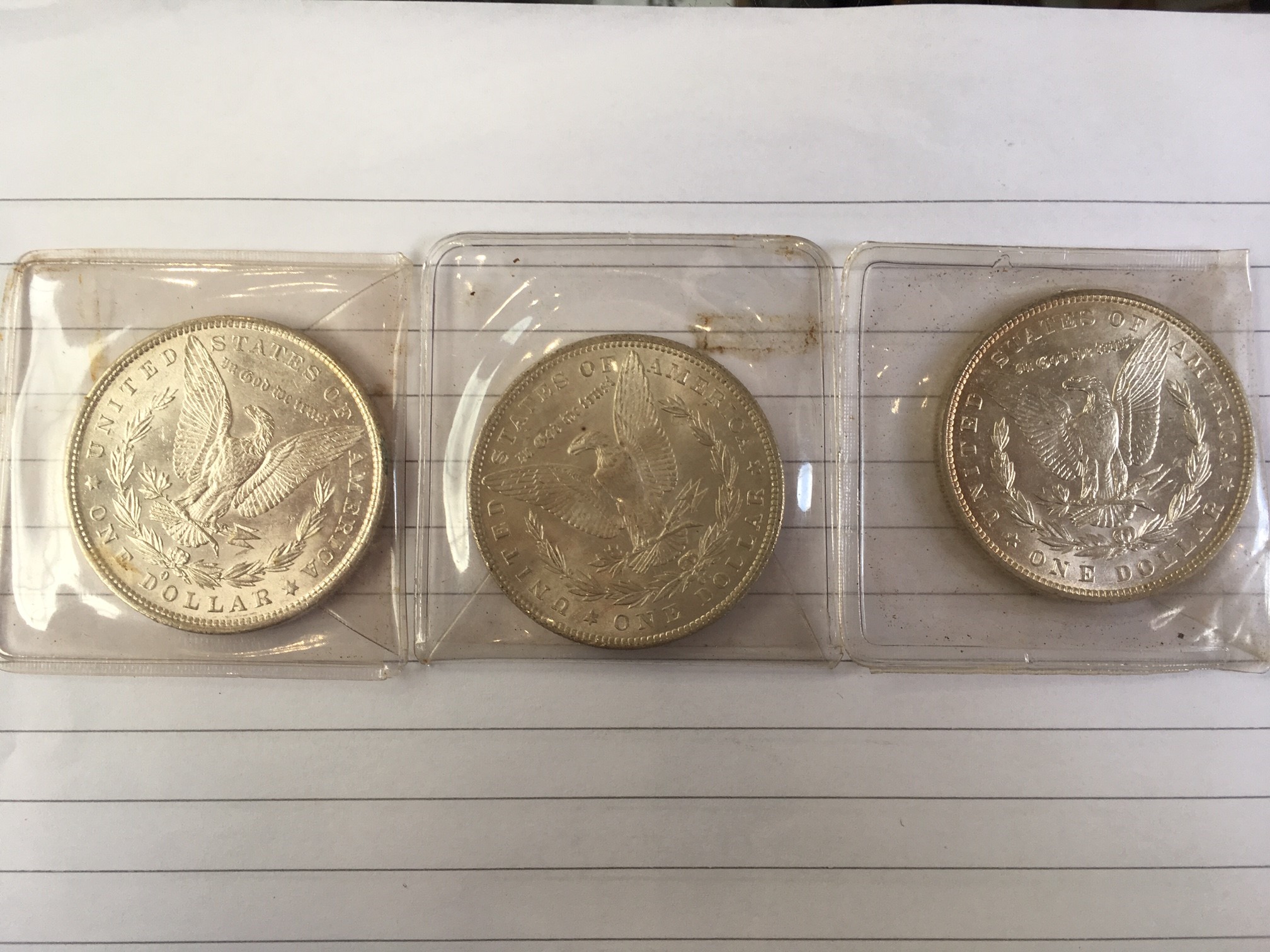 Crown :- 1891 together with three U.S.A. silver dollars, 1879, 1884 and 1887. - Image 2 of 2