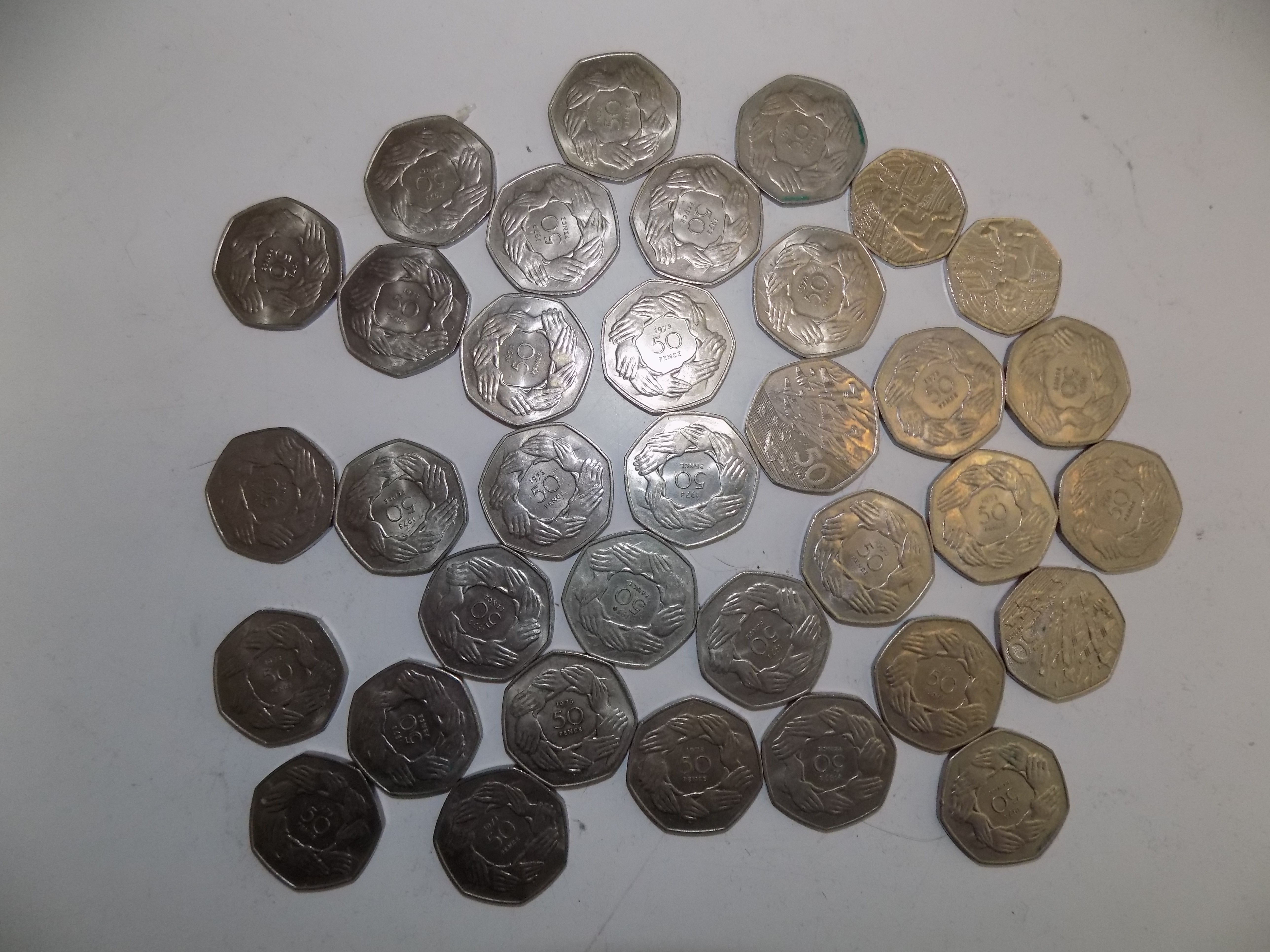 Thirty five 50p coins, most are larger size and in better condition.