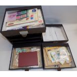 Stamps in packets and loose contained in a four drawer cabinet.