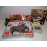A Tronico perforation metal construction kit, Massey Ferguson tractor, two Britains tractors, boxed,