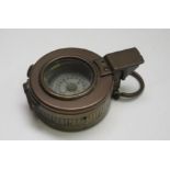 A WWII brass military compass, T.G & Co Ltd, London, dated 1941, MKIII, diameter 6cm.