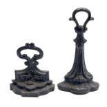 Two Victorian cast iron doorstops, height 32.5cm and 19.5cm.