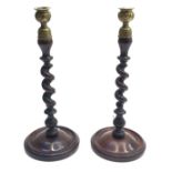 A pair of mahogany barley twist candlesticks, 19th century, height 15cm.