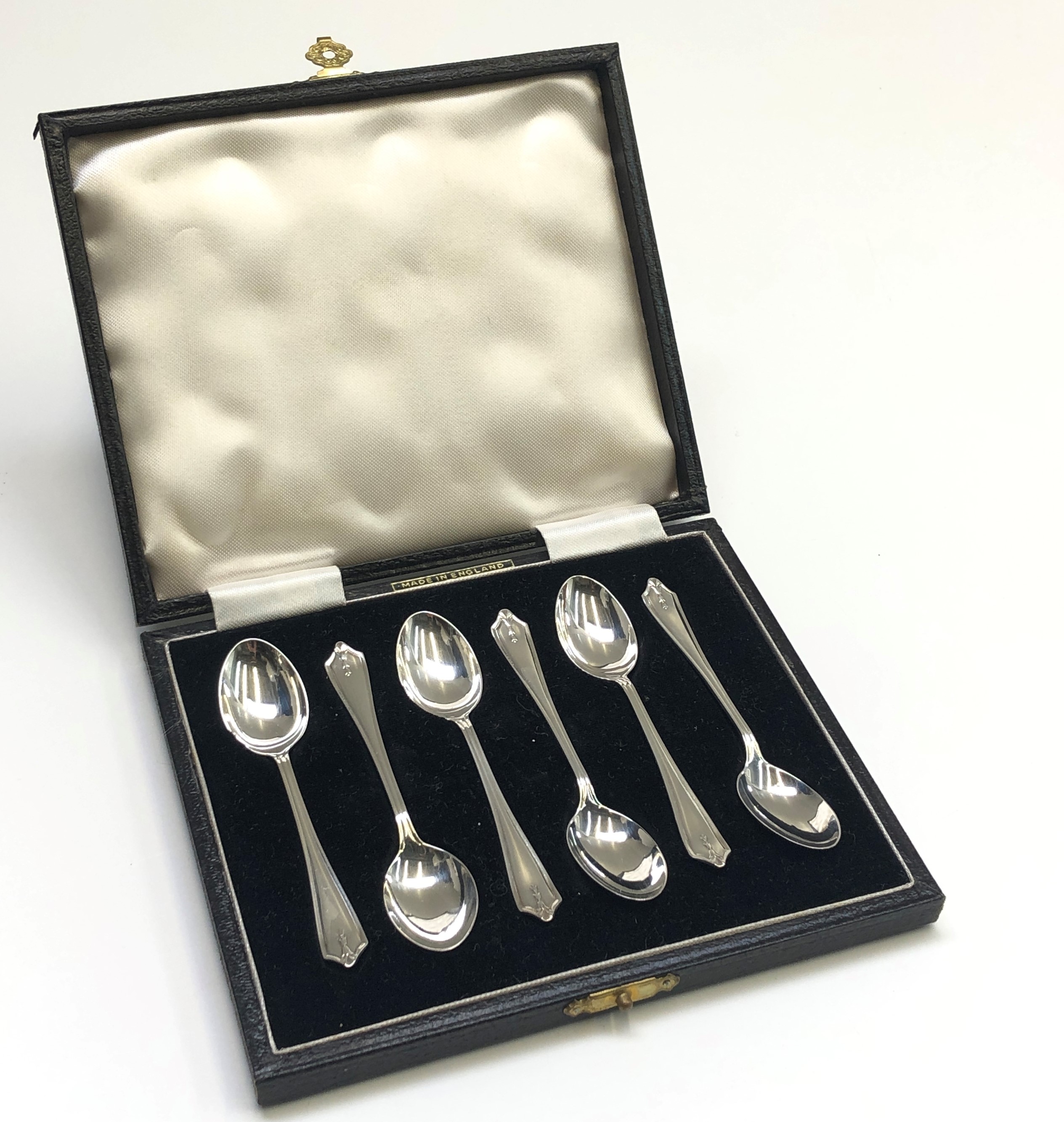 Six silver coffee spoons by the Barker Brothers, Birmingham 1955, cased.