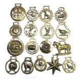 A collection of 17 horse brasses.