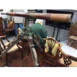 A Victorian brass and wood telescope on an elaborately carved wood tripod stand with metal Roman