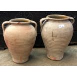Two terracotta olive storage jars. (Dimensions: Height 35cm)(Height 35cm)