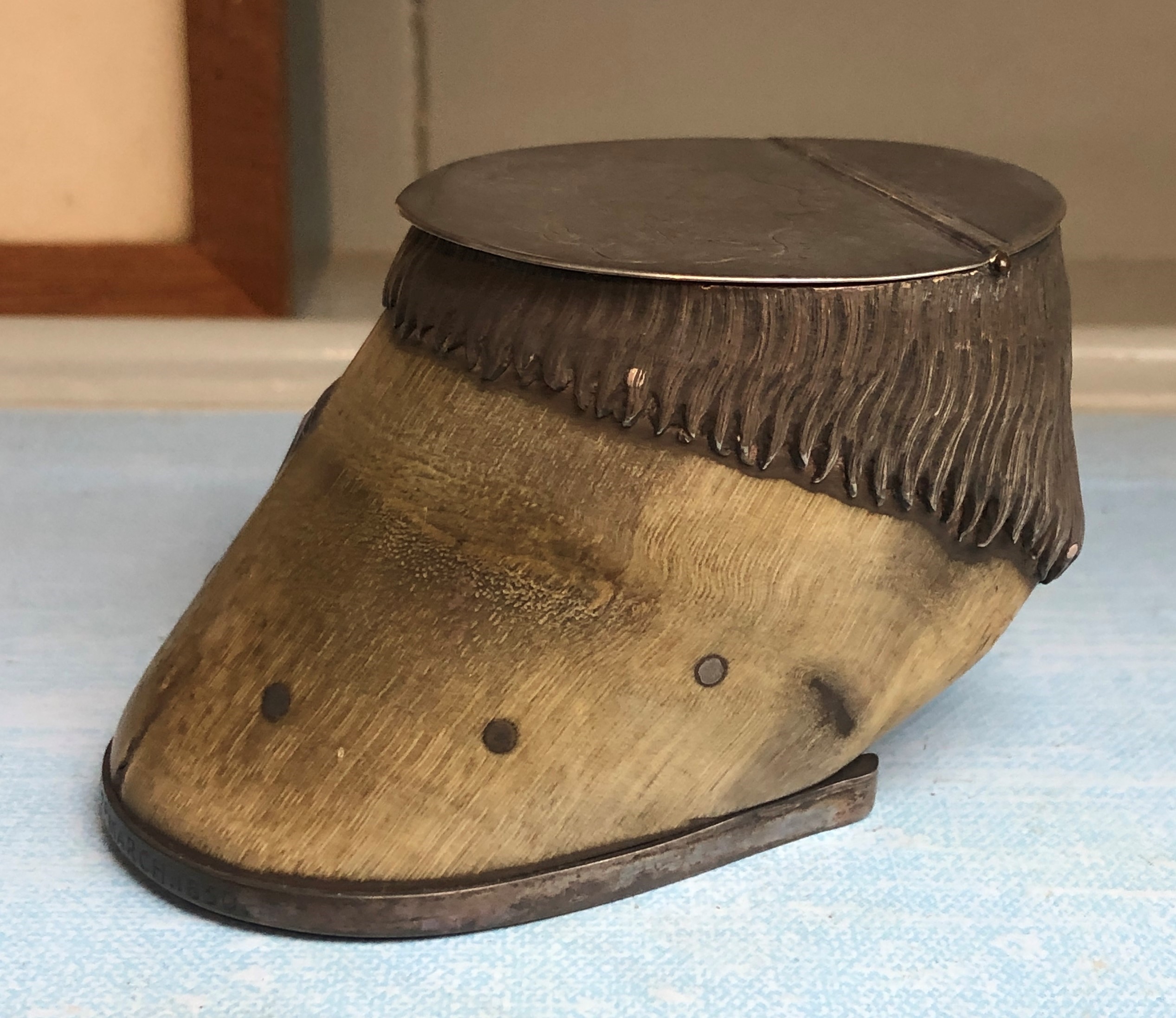 A Victorian silver topped miniature horse hoof snuff box, the lid engraved with armorial motifs