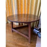 An 18th century oak cricket table with circular top and galleried undertier. (Dimensions: Height