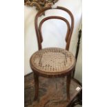 A bentwood child's chairs with rattan seat. (Dimensions: Height 65cm.)(Height 65cm.)