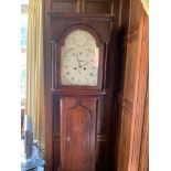 A George III oak cased 8 day longcase clock, J N Liddell, Morpeth, with a painted arched dial. (