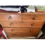 A Victorian mahogany chest of drawers with two short drawers above three long drawers, on turned bun