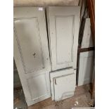 Numerous small grey point painted panelled doors or shutters.
