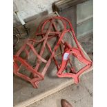 Two wrought and cast iron saddle rests.