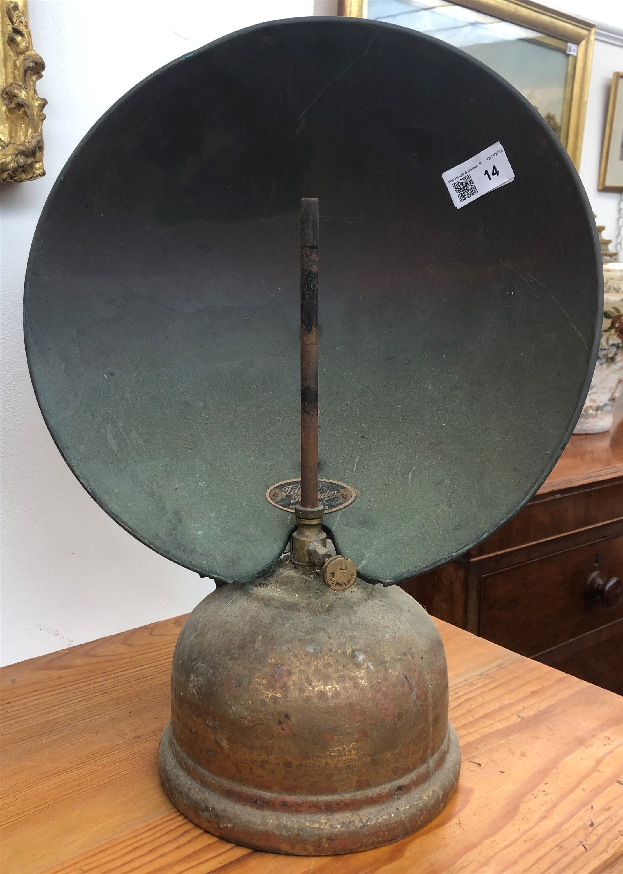 A brass Tilley lamp, with plaque inscribed 'Tilley Radiator', a Victorian brass chestnut roaster and