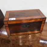 An early 19th century mahogany and satinwood banded tea caddy. (Dimensions: Height 15cm, width