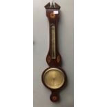 A George III mahogany wheel barometer by A. Alberti, Sheffield, with shell and patera inlaid panels.