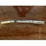 A late 19th/early 20h century Burmese dagger with ivory handle and silver mount and scabbard. (