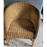Two pairs of wicker chairs and a wicker sofa.