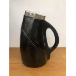 A Royal Doulton silver rimmed jug in the form of a leather jack, impressed mark and numbered 3800.