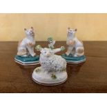 A pair of Staffordshire porcelain cats and a Staffordshire sheep ornament (3). (Dimensions: Height