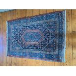 A Bidjar rug, West Persia, the indigo field with a central serrated lozenge medallion, enclosing the