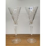 A pair of Waterford crystal champagne flutes. (Dimensions: Height 26cm.)(Height 26cm.)
