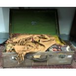 A Native American Indian jacket and other related clothing etc in a canvas covered case.