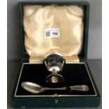 A Silver plain egg cup and spoon, cased, 2oz.