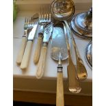 Two pairs of silver plated fish servers, two soup ladles and a crumb scoop.