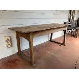 An Arts and crafts weathered light oak Cotswolds style dining table, the top of three planks on