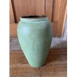 An Arts and Crafts green glazed pottery vase, indistinctly signed to base. (Dimensions: Height